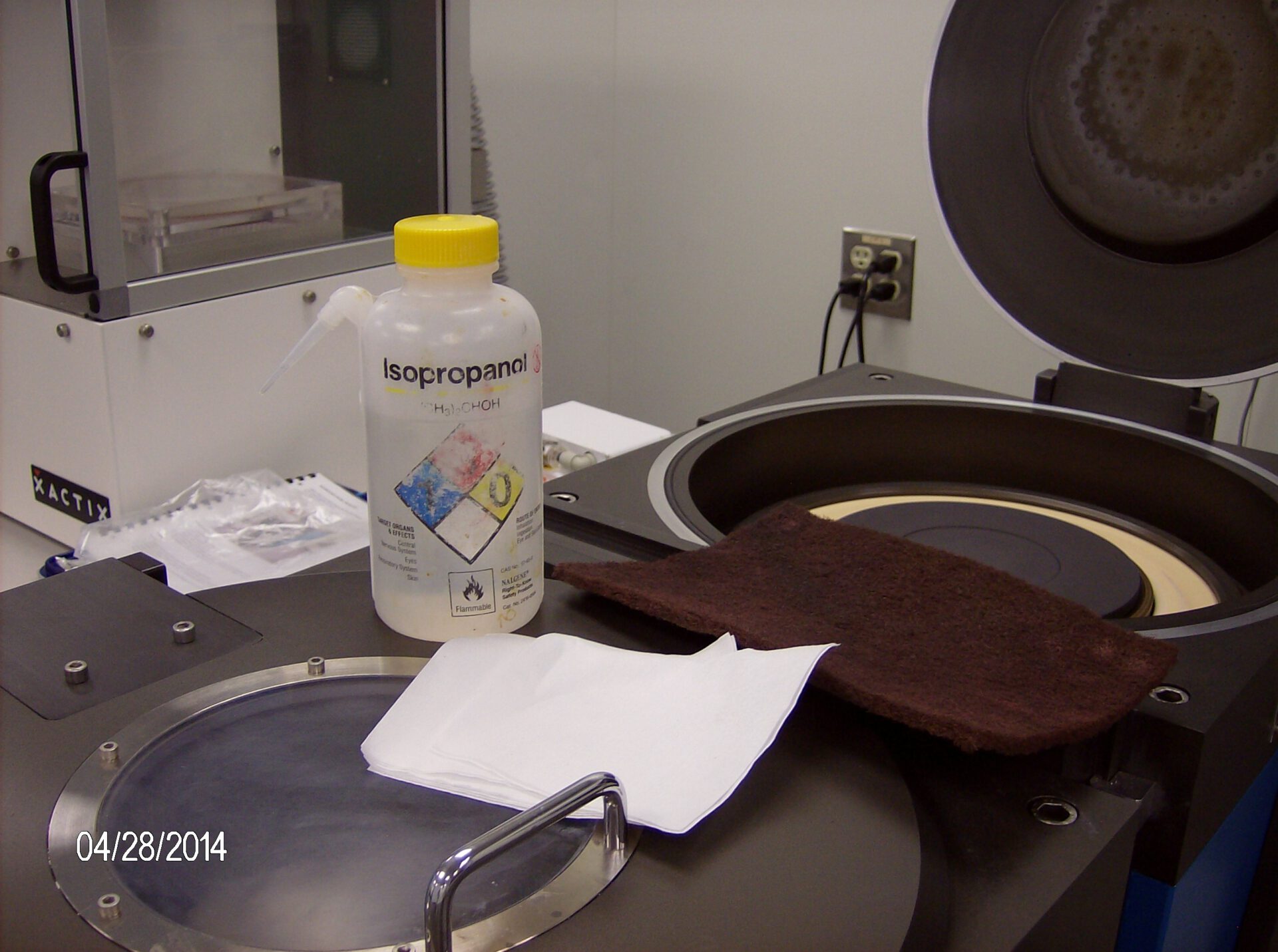 Clean using cleanroom wipes and water then cleanroom wipes and isopropanol